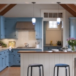 Kitchen of this Martha’s Vineyard beach cottage that was transformed with cool blues, warm woods and natural finishes, interior design that reflects the home’s island roots.