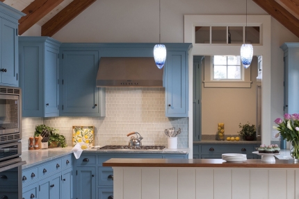 Kitchen of this Martha’s Vineyard beach cottage that was transformed with cool blues, warm woods and natural finishes, interior design that reflects the home’s island roots.