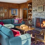 The living room of this newly constructed Vermont farmhouse by Boston Interior Designer Elizabeth Swartz Interiors combines contemporary design elements with traditional architectural details, rich colors and local materials.