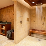 The master bath of a sophisticated mountain retreat combining modern outdoor motifs and rustic materials.