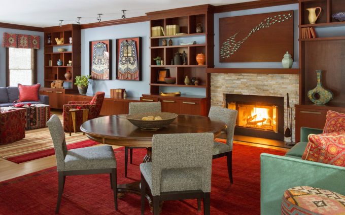 A living room for entertaining in this contemporary interior design in Boston that blends a diverse art collection with sophisticated materials such as natural stone, warm woods, glass, and modern fabrics.