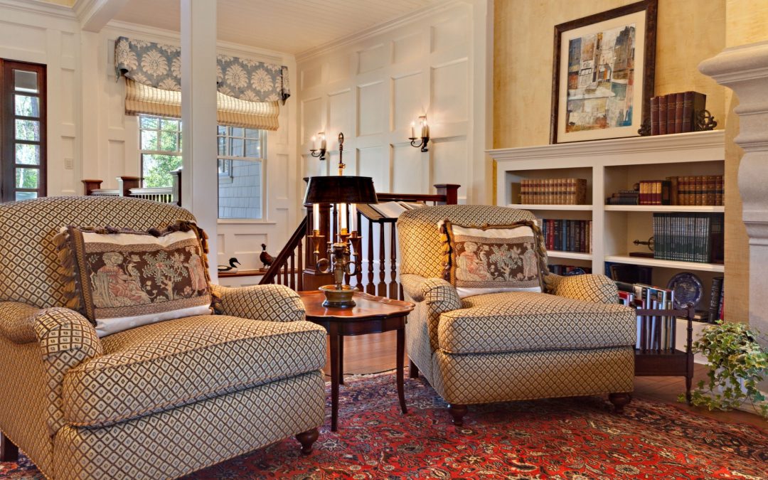 At the top of the stairs on the main level of this Georgia lake house is a formal living room designed  for entertaining and conversation by Boston Interior Designer Elizabeth Swartz Interiors.