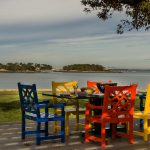 These Boston home owners are dining in style with this bright, colorful outdoor dining room furniture designed by Boston Interior Designer Elizabeth Swartz Interiors.