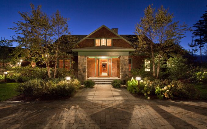 The main entrance of this White Mountain retreat designed by Boston Interior Designer Elizabeth Swartz Interiors makes a grand statement.