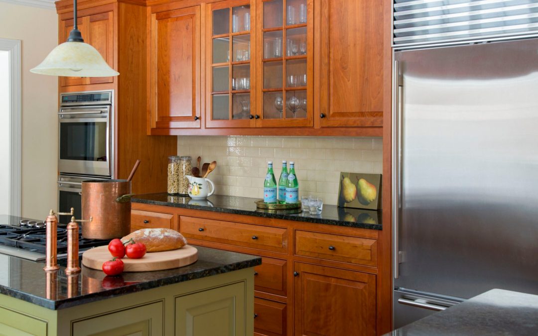 The kitchen of this Boston-area home features custom cabinetry. Traditional Colonial Interior Design by Elizabeth Swartz Interiors.