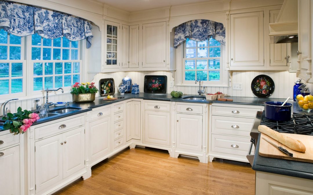 Three smaller rooms were combined by Boston Interior Designer Elizabeth Swartz Interiors to create a new kitchen and breakfast room.