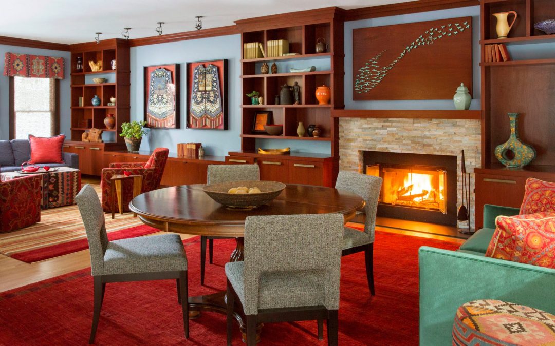 A living room for entertaining in this contemporary interior design in Boston that blends a diverse art collection with sophisticated materials such as natural stone, warm woods, glass, and modern fabrics. 