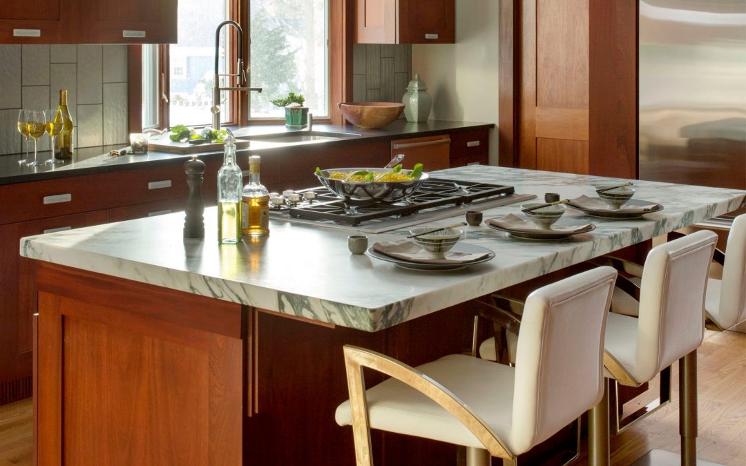 This Boston contemporary kitchen combines contemporary design elements with a diverse art collection with sophisticated materials such as natural stone, warm woods and glass.