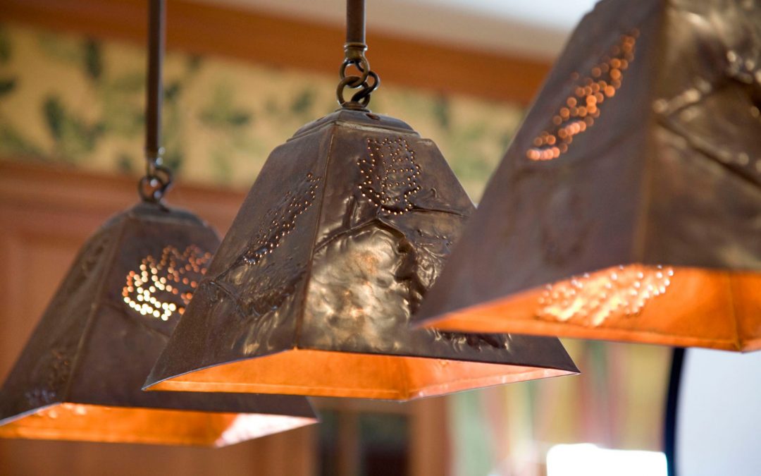 Custom copper lighting in the kitchen of this White Mountain retreat uses modern outdoor motifs by Boston Interior Designer Elizabeth Swartz Interiors.