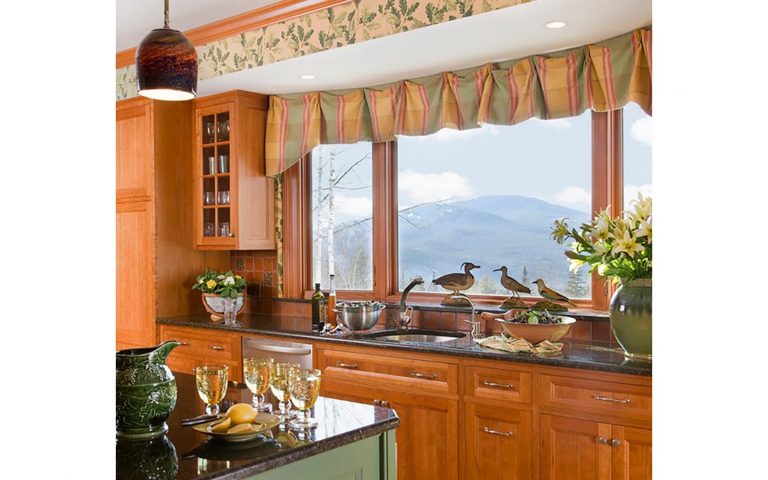 Custom window treatments frame the beautiful view of the White Mountains in this mountain retreat design by Boston Interior Designer Elizabeth Swartz Interiors.