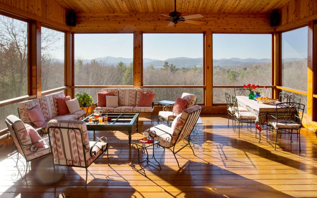 No Vermont farmhouse would be complete without a sun porch overlooking the Green Mountains. Interior design by Boston Interior Designer Elizabeth Swartz Interiors.