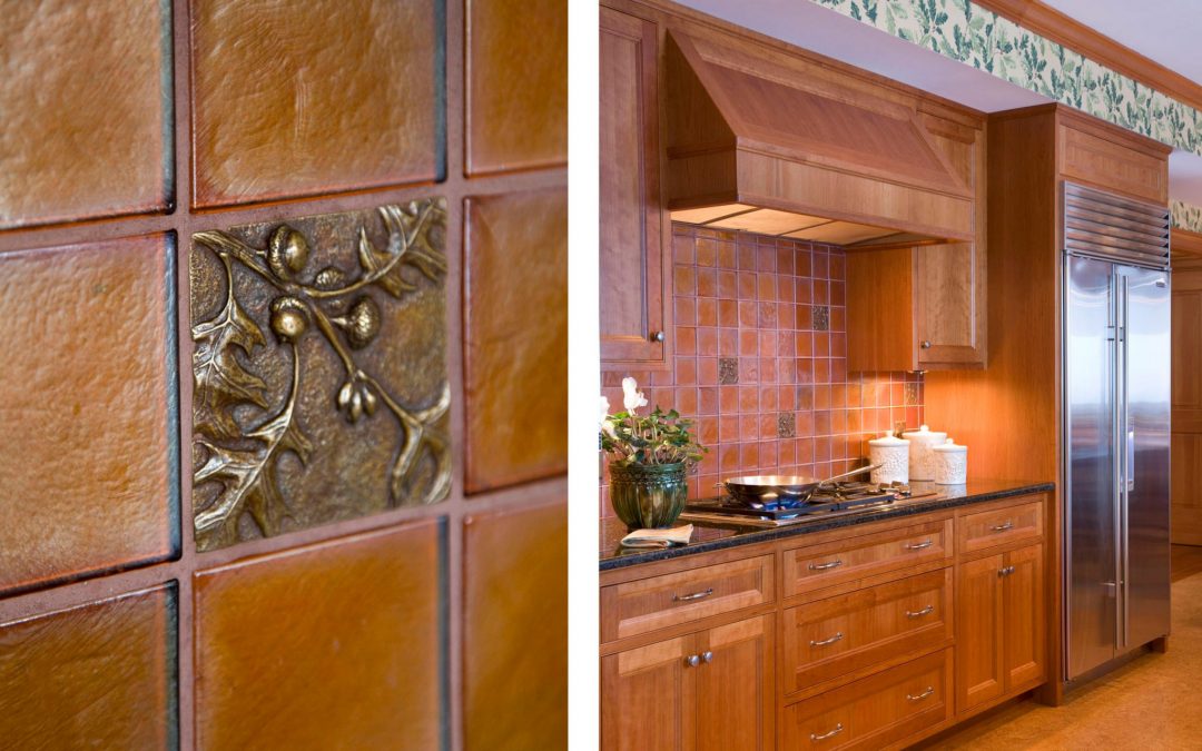 The backsplash of the expansive kitchen in this White Mountain retreat designed by Boston Interior Designer Elizabeth Swartz Interiors features hand made metallic tiles with a modern outdoor motif.