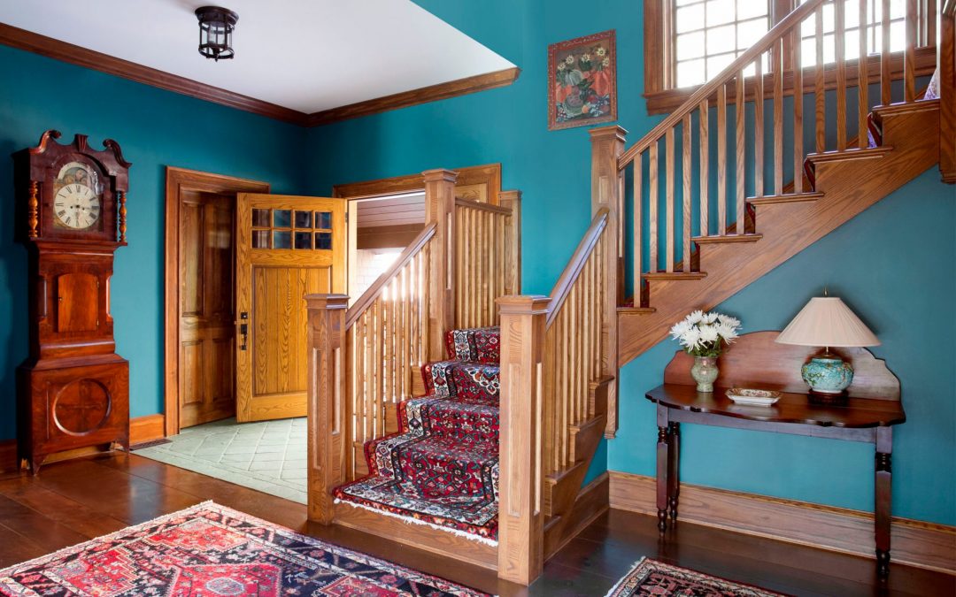 The main entry of this Vermont farmhouse by Boston Interior Designer Elizabeth Swartz Interiors combines contemporary design elements with traditional architectural details, rich colors and local materials. 