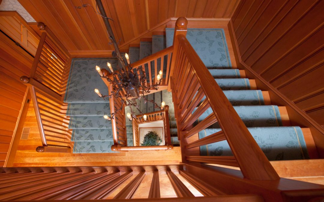 The stairwell in this White Mountain retreat designed by Boston Interior Designer Elizabeth Swartz Interiors combines modern outdoor motifs and rustic materials for a distinctive look. The carpet runner is custom designed by Elizabeth Swartz Interiors for this home.