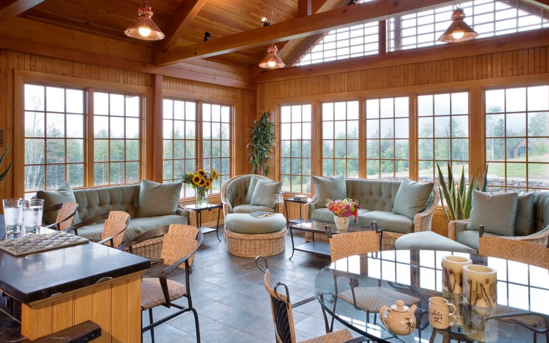 The Pool House in the White Mountain retreat features a great room for entertaining. Boston Interior Designer Elizabeth Swartz Interiors maintained the same color schemes and natural motifs throughout the pool house to create a cohesive look with the main home of this New Hampshire family retreat.