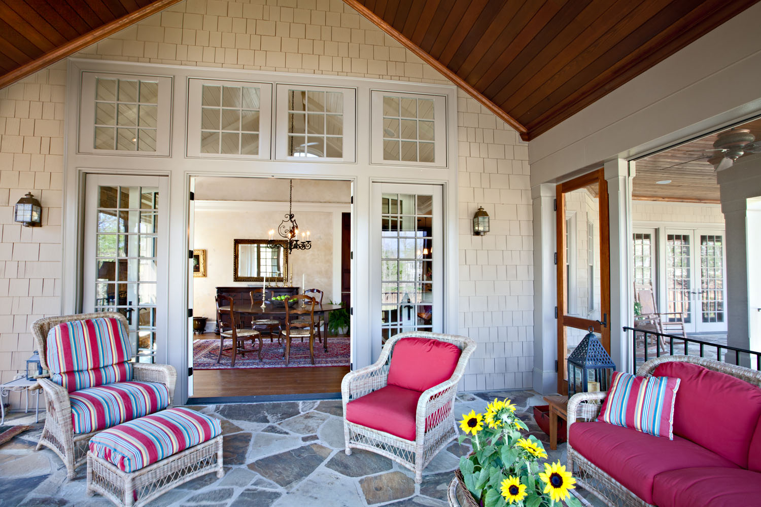 Boston interior designer Elizabeth Swartz Interiors designed the porch to coordinate with the interior of the home.