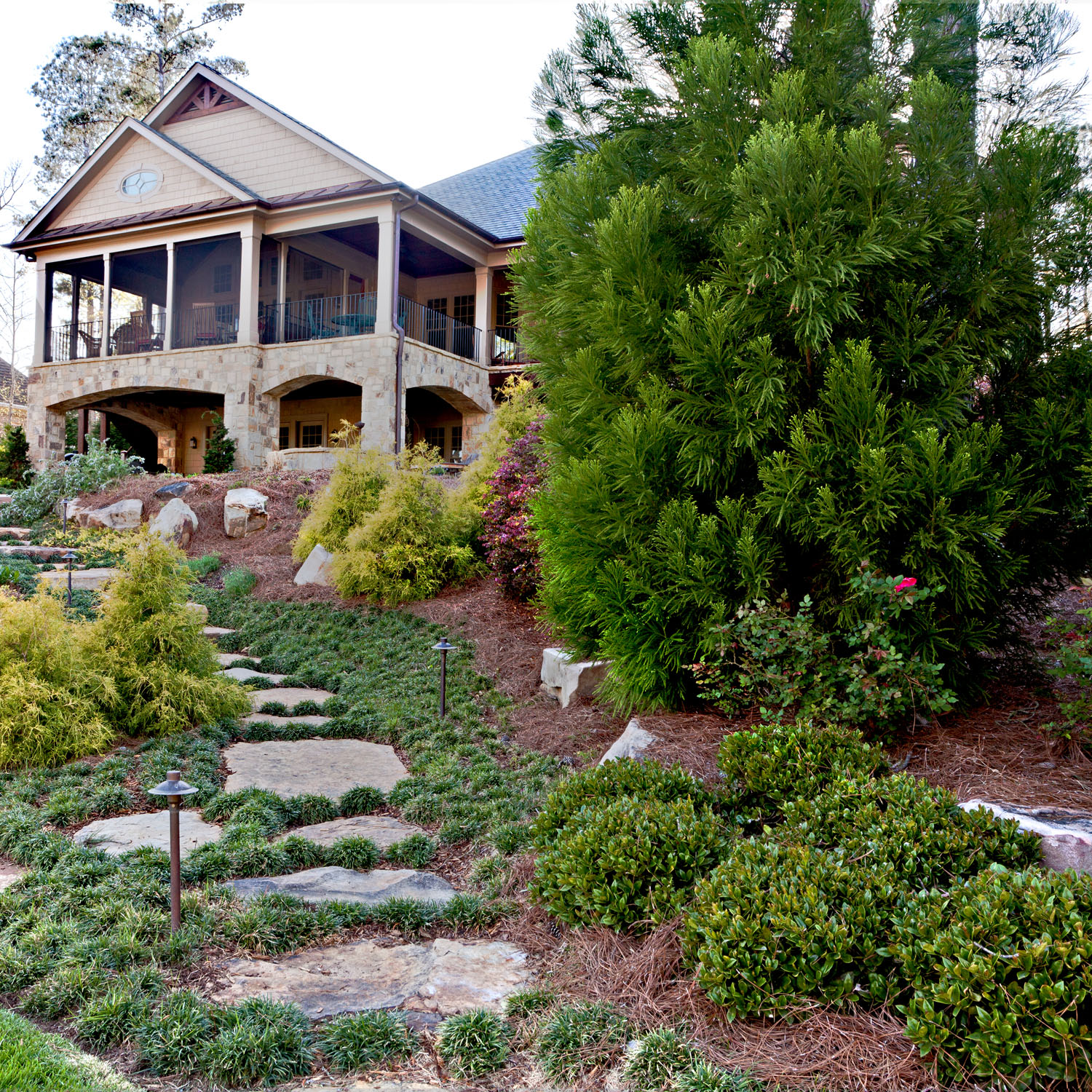 A stone pathway from the house to the dock makes living outdoors easy.